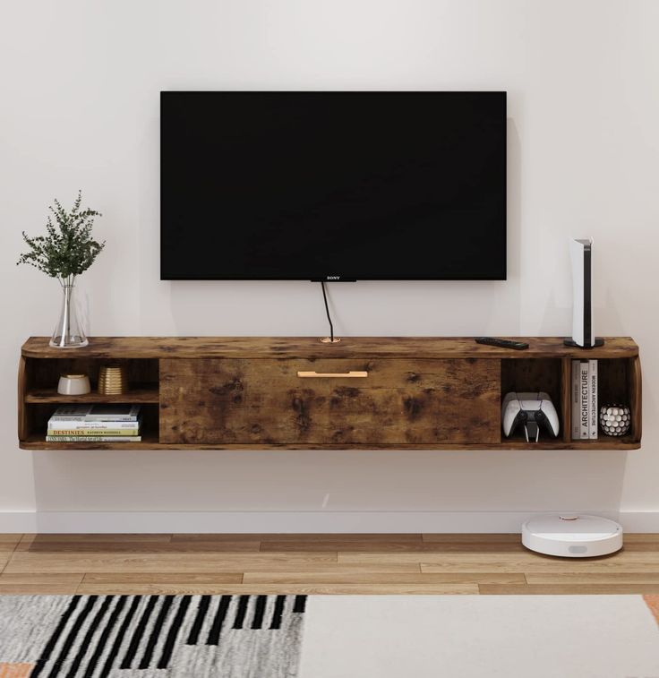 a flat screen tv mounted to the side of a wooden shelf in a living room