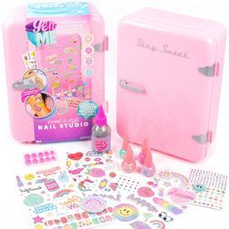 a pink suitcase with stickers, nail polish and other items in front of it