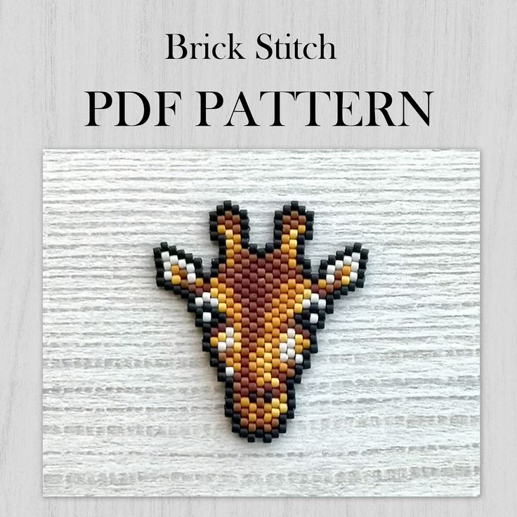 a cross stitch giraffe pattern is shown on a white wooden background with the words brick stitch