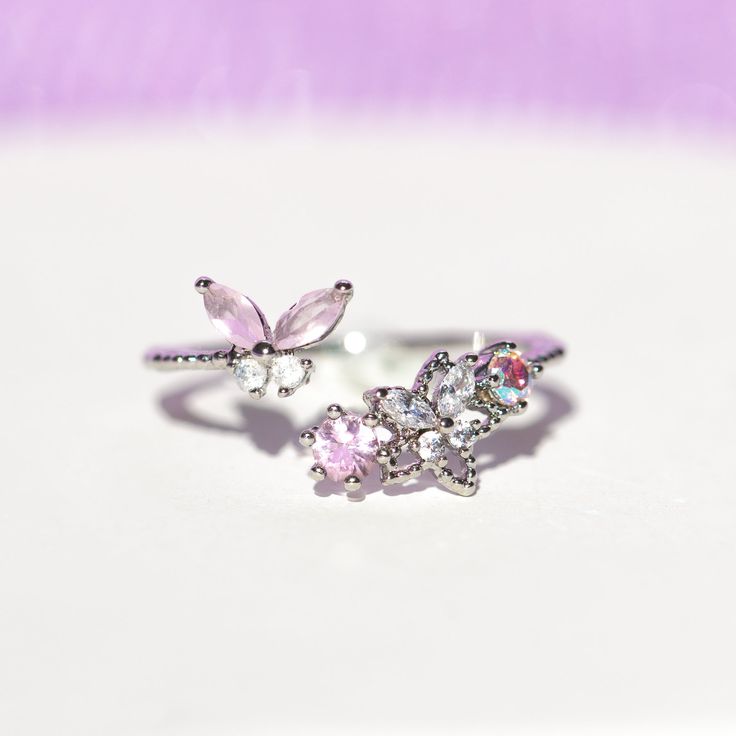 This ring is meant to wear during all the precious moments in your life. We love mixing butterfly, floral, and celestial motifs in one design. Add a pop of pink to your jewelry collection with our Precious Moments Ring. Celestial Motifs, Precious Moments, One Design, 18k Rose Gold, Rose Gold Plates, Rose Gold Ring, Rhodium Plated, Cubic Zirconia, Gold Rings