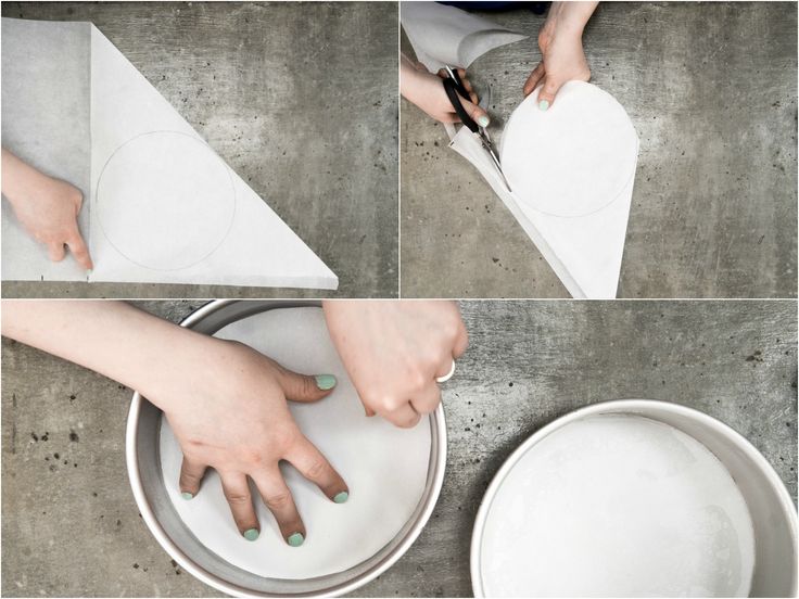 someone cutting paper with scissors in the shape of a heart on top of a plate