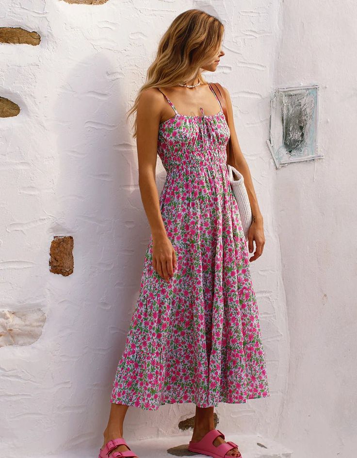 Block-printed by hand in the much-loved Lolita print, the Seychelles dress is a summer favorite you won’t want to take off. We love the pop of neon pink set against the zesty green in this vibrant print. Finished with adjustable spaghetti straps, a full, tiered skirt and rows of elastic under the bust, the Seychelles dress is an effortless and flattering piece you’ll wear again and again. Perfect for beach holidays, warmer days ahead and evenings out. Pink City Prints was founded to preserve the Summer Tropical Print Midi Sundress, Summer Midi Sundress With Tropical Print, Multicolor Floral Print Midi Beach Dress, Multicolor Floral Print Midi Dress For Beach, Multicolor Tropical Print Midi Dress For Summer, Green Tropical Print Floral Dress For Summer, Beachwear Floral Print Dress With Spaghetti Straps, Summer Printed Midi Dress For Garden Party, Sleeveless Midi Dress With Vibrant Print For Vacation