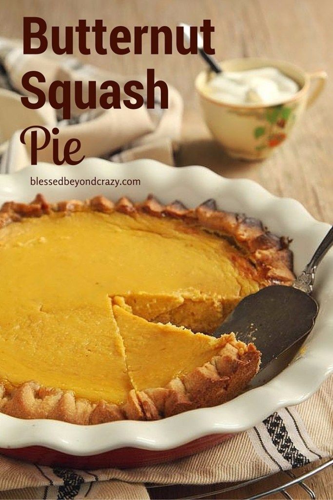 a butternut squash pie in a white dish with a piece missing from the pie