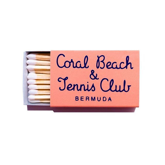 two matches are in a matchbox with the words coral beach and tennis club on it