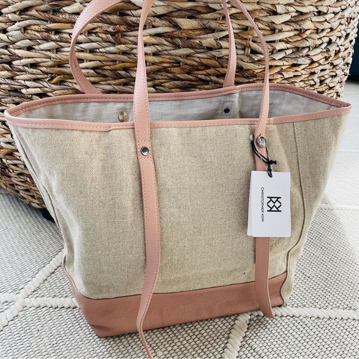 Beautiful Spring/Summer Tote In Oatmeal Linen And Pale Pink Pebbled Leather. Straps Are Adjustable With Logo Silver Hardware. Interior Zipper Pocket (Still Wrapped In Tissue). Measures 15” Long, 12” High, 7” Wide - Nice Substantial Size For Carry-On Travel Bag, Summer Purse Or Beach/Boat Tote. New Condition With No Flaws. Casual Beige Canvas Bag, Beige Canvas Bag For Spring Travel, Casual Beige Bucket Canvas Bag, Casual Khaki Canvas Bag With Leather Handles, Casual Beige Canvas Travel Bag, Casual Beige Canvas Bag For Everyday, Beige Bucket Canvas Bag With Leather Handles, Brown Canvas Bag With Leather Handles For Summer, Beige Summer Canvas Bag For Daily Use