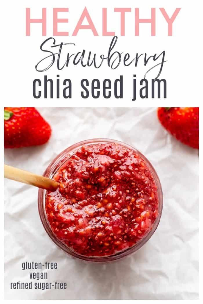 strawberry chia seed jam in a glass jar with strawberries on the side and text overlay that reads healthy strawberry chia seed jam