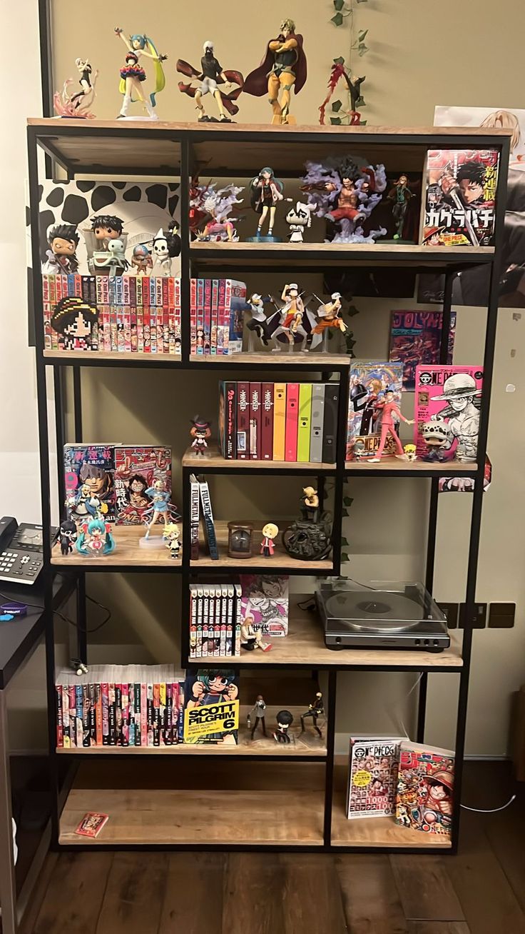 a book shelf filled with lots of comics and figurines on top of it