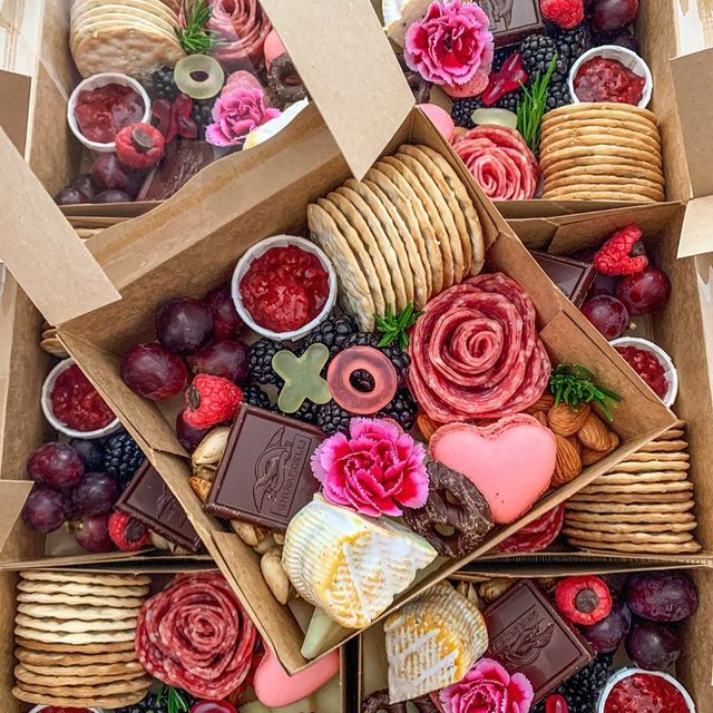 a box filled with lots of different types of food and desserts on top of each other