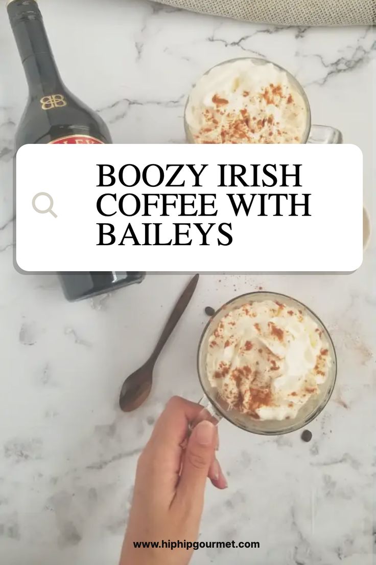 boozy irish coffee with bailey's on the side and two mugs filled with whipped cream