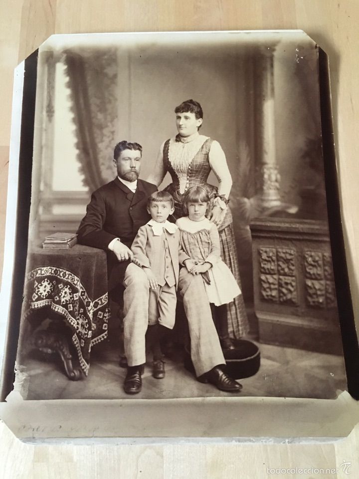 an old black and white photo of a family