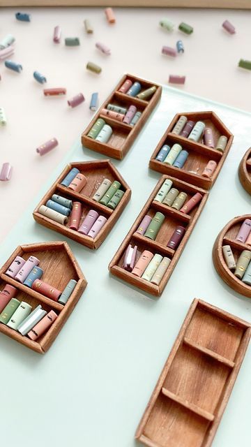 several wooden boats with bookshelves on them and scattered confetti in the background