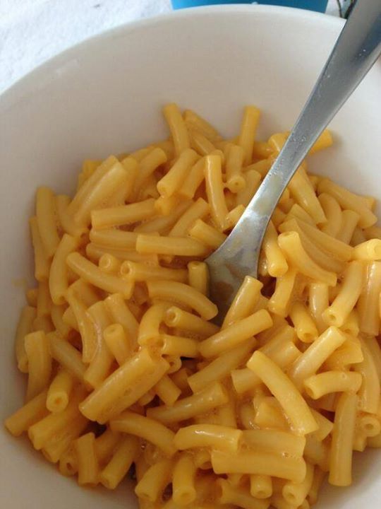 a white bowl filled with macaroni and cheese