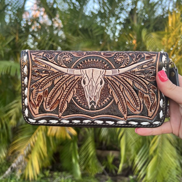 Western leather wallet, tooled leather, hand made, tooled leather western, country girl purse, country girl wallet, zip up leather wallet, cowskull wallet, western wallet, western inspired wallet, longhorn wallet, western fashion, western inspired outfit, western outfit inspo, western purse, western crossbody, western boutique, country girl fashion, country girl outfit, rodeo outfit, rodeo fashion, country concert outfit, country concert outfit inspo, casual country outfit, everyday country styl Brown Embossed Wallet For Everyday Use, Brown Hand-tooled Wallets For Everyday Use, Traditional Wallets With Card Slots For Everyday Use, Hand Tooled Bifold Clutch For Everyday Use, Traditional Wallets With Card Slots, Traditional Bifold Wallets For Everyday Use, Traditional Bifold Wallet For Everyday Use, Hand Tooled Coin Purse, Artisan Hand-tooled Wallets For Everyday Use