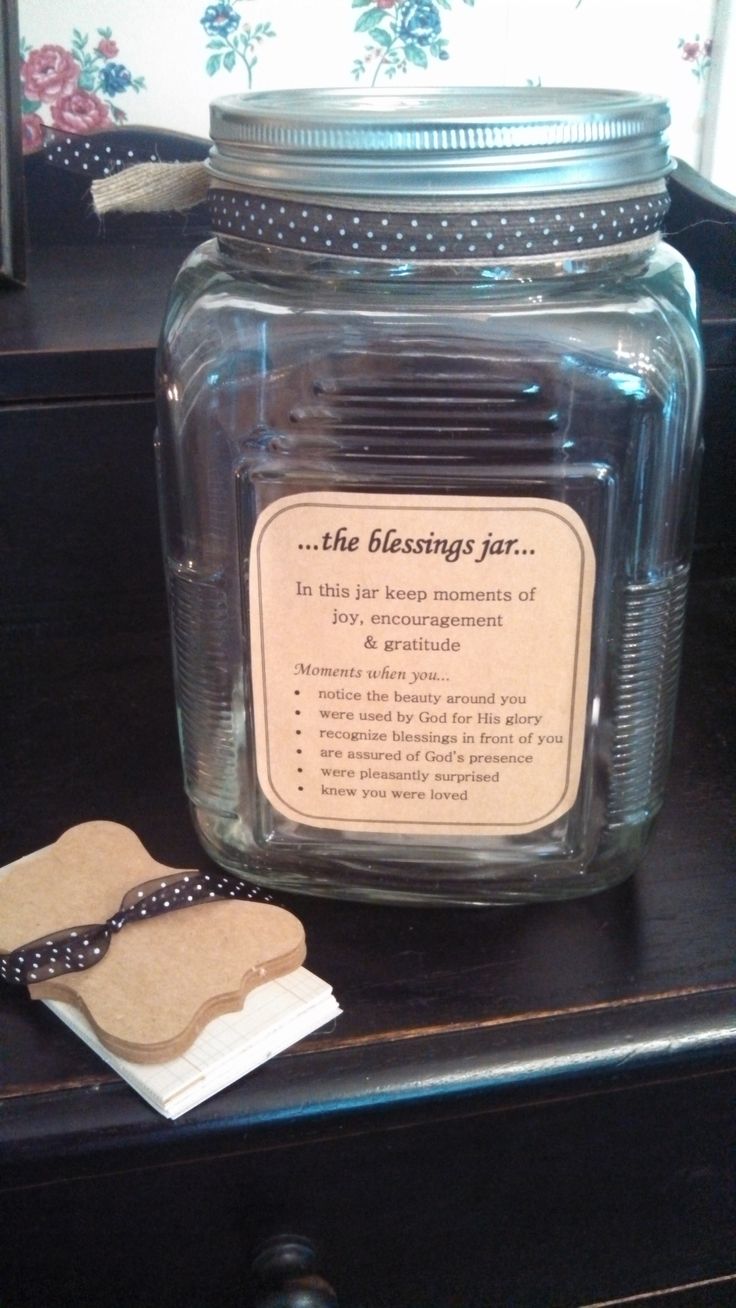 a glass jar with some tags on it