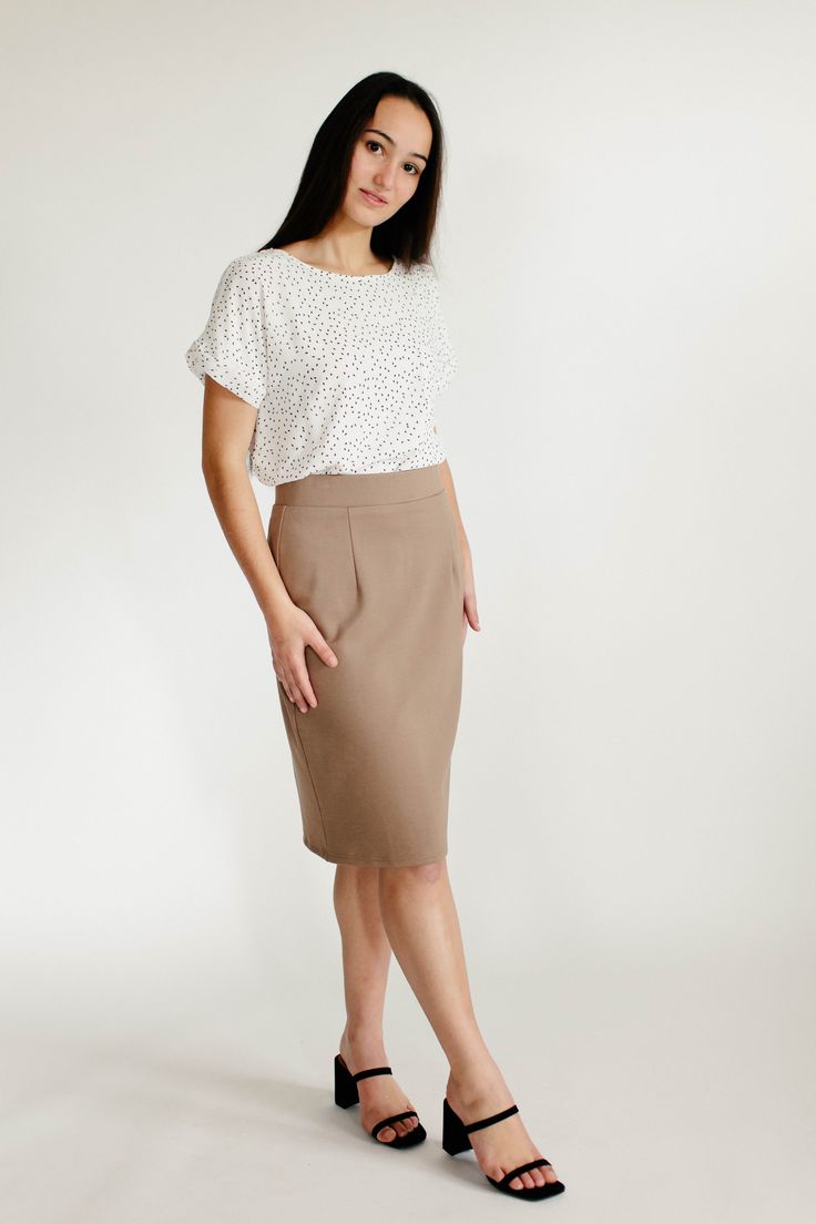 With clean, simple lines and sophisticated style, the 'Anna' is the perfect pencil skirt your closet has been waiting for. Quality fabric, full lining and structured style ensure a modest and flattering fit while an elastic waistband keeps you comfortable. Exclusively designed with you in mind! 68% Rayon 27% Nylon 5% Spandex Hand Wash Cold Separately or With Like Colors Do Not Bleach Hang to Dry Low Iron if Needed 1.75" Waistband Fully Lined ﻿Color may be slightly darker than shown Model Height Summer Office Wear Fitted Pencil Skirt, Fitted Pencil Skirt For Summer Office Wear, Modest Fitted Skirt For Workwear, Flattering Summer Skirt For Work, Summer Business Casual Pencil Skirt, Business Casual Pencil Skirt For Summer, Business Casual Summer Pencil Skirt, Summer Midi Pencil Skirt For Workwear, Brown Lined Skirt For Workwear