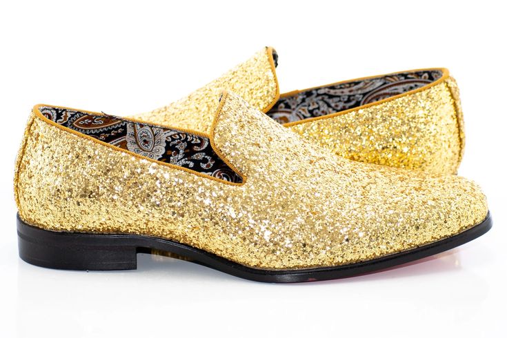 a pair of gold glitter shoes with black soles