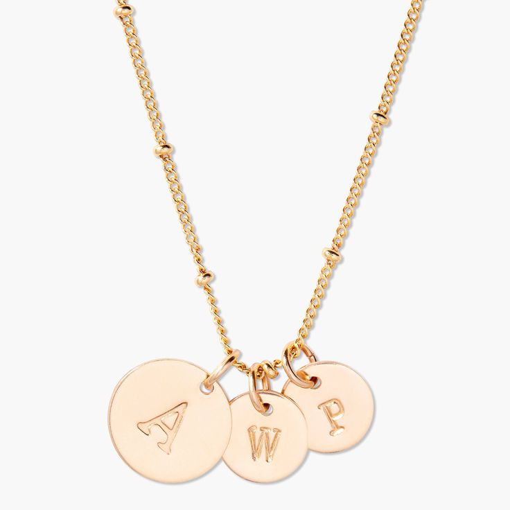 Create a personalized pendant with three initials, expertly crafted from premium gold. Show the world your individual style, and make it personal with this beautiful and meaningful pendant. Make a statement that's uniquely you. How will you show your style? 1/2" and 3/8" gold filled and sterling silver filled disc Hand stamped initial 16" brass satellite chain with 2" extender Lobster claw closure With customization this item is FINAL SALE NOTE - discs DO NOT slide on and off the chain. If you a Classic Rose Gold Plated Charm Necklaces, Classic Mother's Day Charm Necklaces With Initial Pendant, Gold Sterling Silver Initial Necklace With Charms, Rose Gold Initial Pendant Name Necklace, Rose Gold 14k Gold Name Necklace With Initials, Rose Gold 14k Gold Initials Name Necklace, Rose Gold 14k Gold Initials Necklace, Everyday Rose Gold Initial Pendant Necklace, 14k Rose Gold Initials Name Necklace