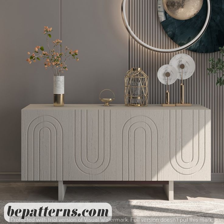 a white cabinet sitting in front of a wall with flowers and plants on top of it