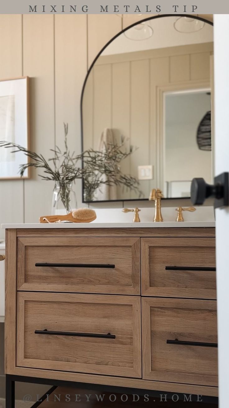 a bathroom vanity with two sinks and mirrors above it is featured in an article about mixing metal tips