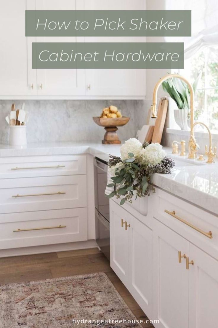 a kitchen with white cabinets and gold hardware on the countertop, is featured in this article