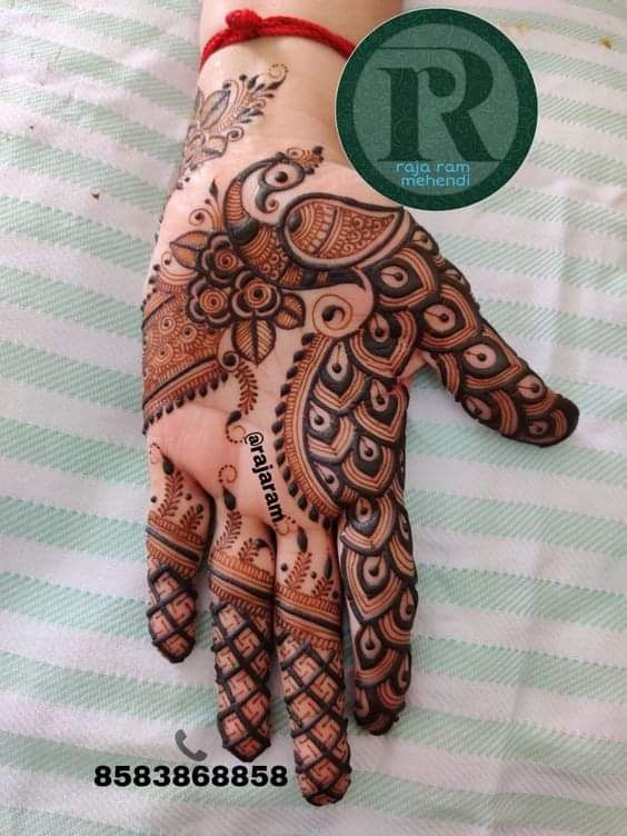 henna tattoo on the palm of someone's hand