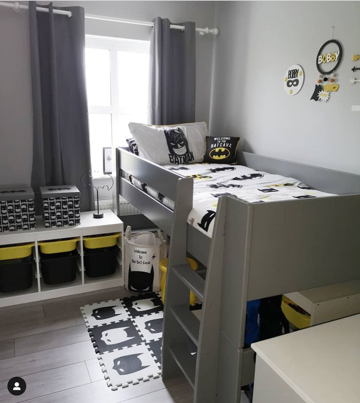 a bedroom with bunk beds and black and white rugs