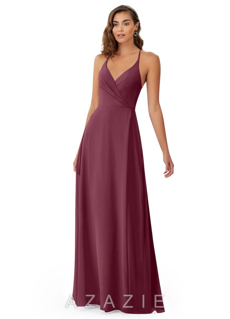 a woman in a long purple dress with one shoulder and straps on the waist,