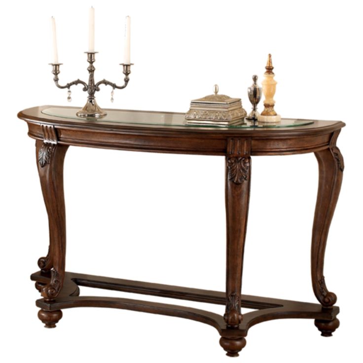 a console table with two candles on it