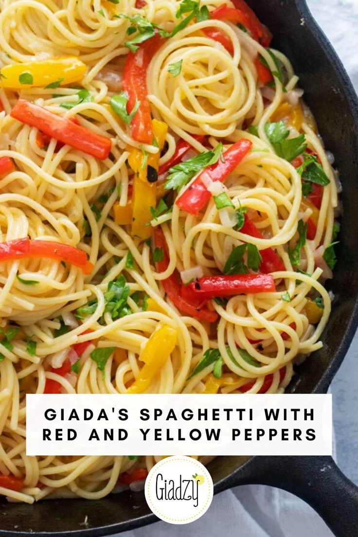 a skillet filled with pasta and peppers