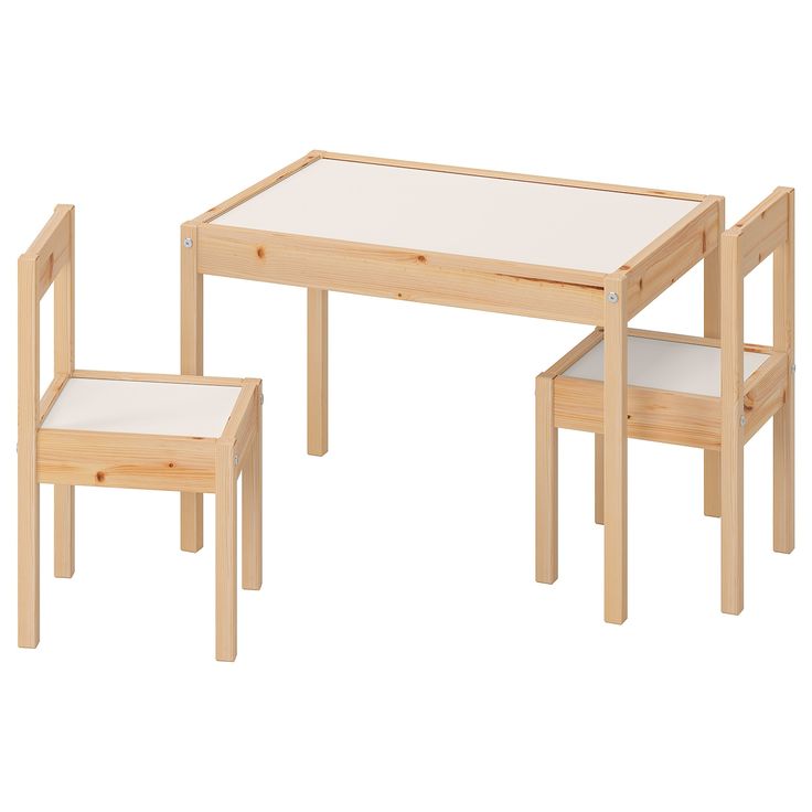 a wooden table with two chairs next to it