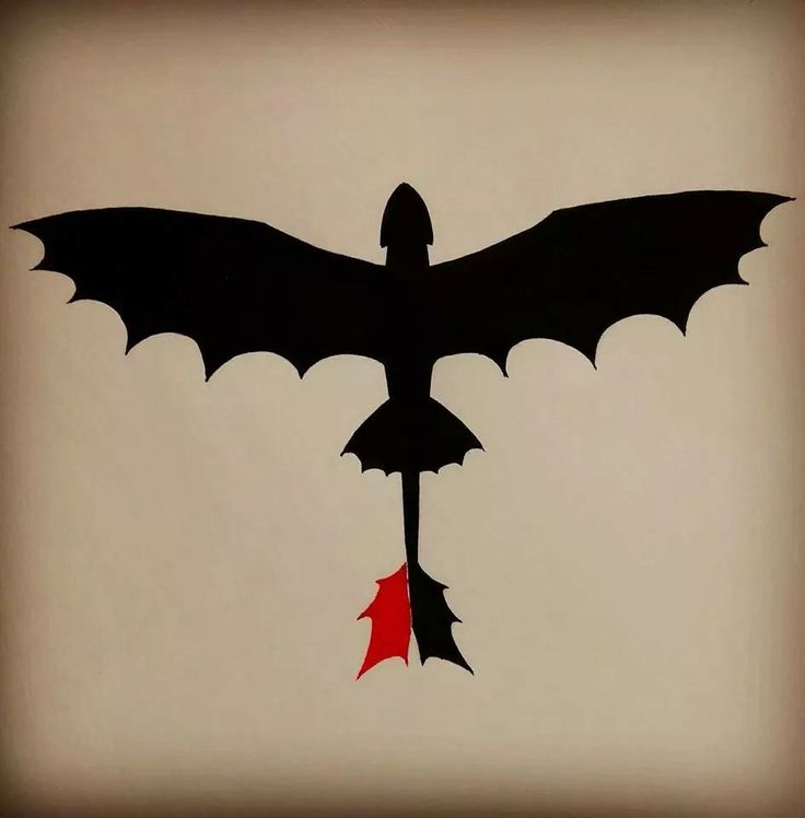 a black and red bat flying through the air