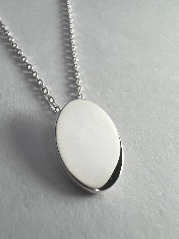 "Minimal \"Oval\" Sterling Silver Necklace By SterlingVerse 🤍Solid Sterling Silver Pendant + 18 inch x 2mm chain 🤍 Minimal in style, floating by design 🤍 Lifetime Warranty 🤍 Free Shipping ✈️" Cheap Oval Sterling Silver Necklaces, Silver Necklace With Oval Pendant, Classic Necklaces With Delicate Oval Chain, Silver Oval Cable Chain Jewelry, Classic Oval Necklaces With Delicate Chain, Classic Oval Necklace With Delicate Chain, Minimalist Oval Link Necklace With Polished Finish, Modern Oval Jewelry With Delicate Chain, Oval Silver Jewelry With Cable Chain