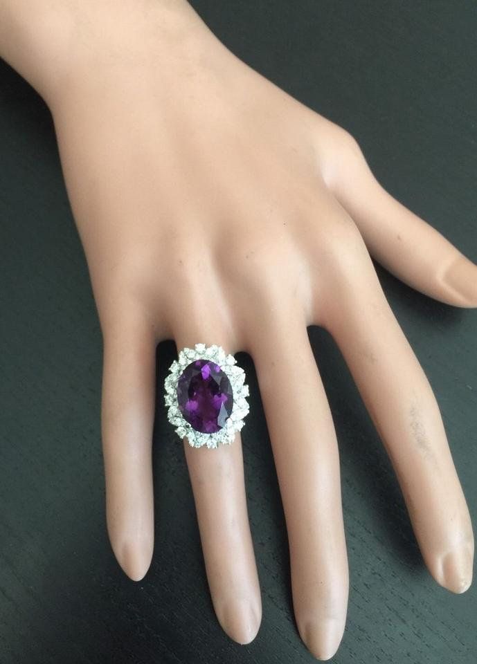 9.10 Carats Exquisite Natural Amethyst and Diamond 14K Solid White Gold Ring Suggested Replacement Value Approx. $6,800.00 Total Amethyst Weight is: Approx. 8.00 Carats Amethyst Measures: Approx. 16.00 x 12.00mm Natural Round Diamonds Weight: Approx. 1.10 Carats (color G-H / Clarity SI1-SI2) Ring total weight: Approx. 9.0 grams Disclaimer: all weights, measurements and colors are approximate and may vary slightly from the listed dimensions or as seen in the image. All pictures are magnified to s Formal Purple Gemstone Cluster Ring, Purple Gemstone Cluster Ring For Formal Occasions, Formal Oval Cluster Ring With Gemstone Accents, Emerald Cut Aquamarine Ring, Emerald Cut Rings, Etsy Gold Ring, Amethyst Gem, Purple Band, Aquamarine Rings