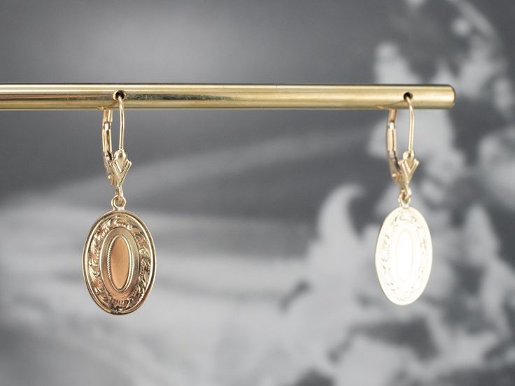 These beautiful earrings were handcrafted by our studio, using pieces of antique cufflinks! The handsome, sophisticated dangles are a beautiful yellow 14k gold that is chased with beautiful scrolling details! These date to the Victorian era! We've created bails and hung them on leverbacks of 14K yellow gold. Metal: 14K Yellow Gold Earrings Length: 32 mm Earrings Width: 11 mm Marks: “14K” Stamped on the reverse Victorian Engraved Earrings For Formal Occasions, Formal Engraved Drop Earrings, Antique Yellow Gold Earrings For Formal Occasions, Antique Yellow Gold Earrings For Formal Events, Victorian Style Hallmarked Earrings For Formal Occasions, Victorian Dangle Earrings For Formal Occasions, Formal Victorian Hallmarked Earrings, Formal Engraved Dangle Earrings, Antique 14k Gold Hallmarked Earrings