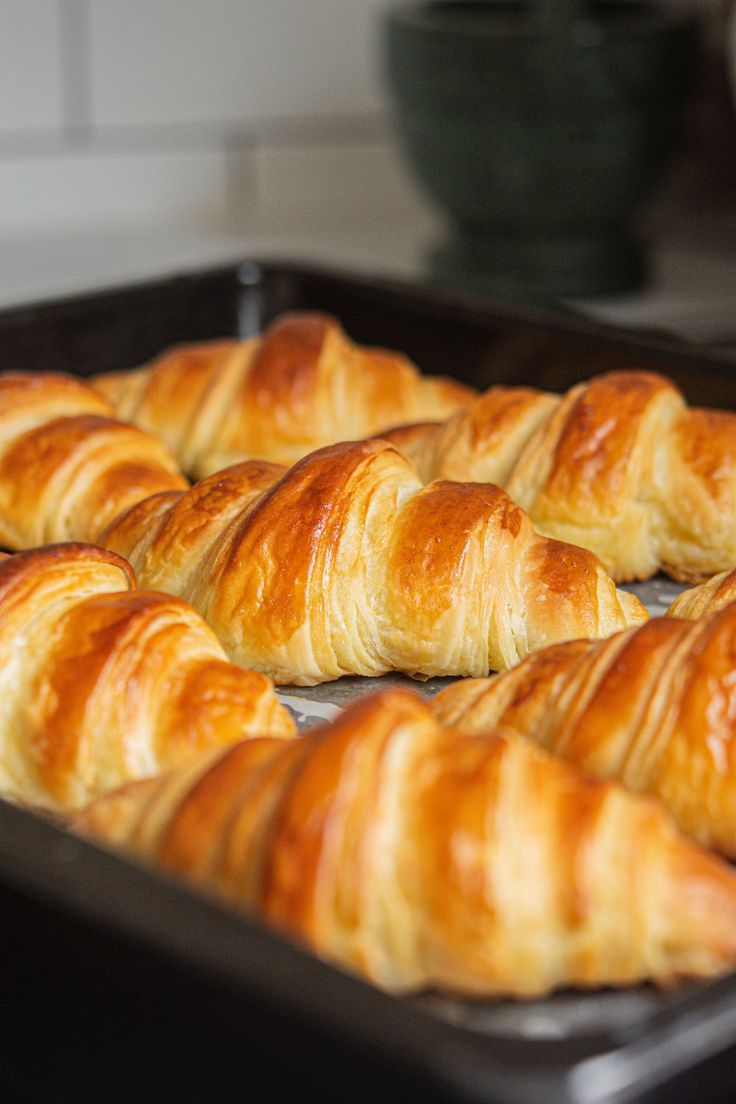 freshly baked croissants on a baking sheet