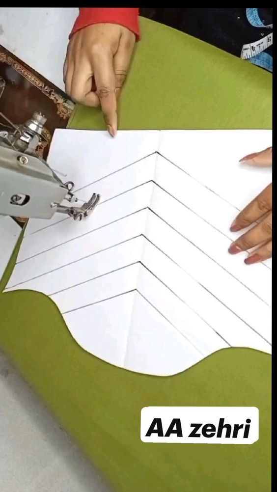 someone is cutting out paper with a sewing machine