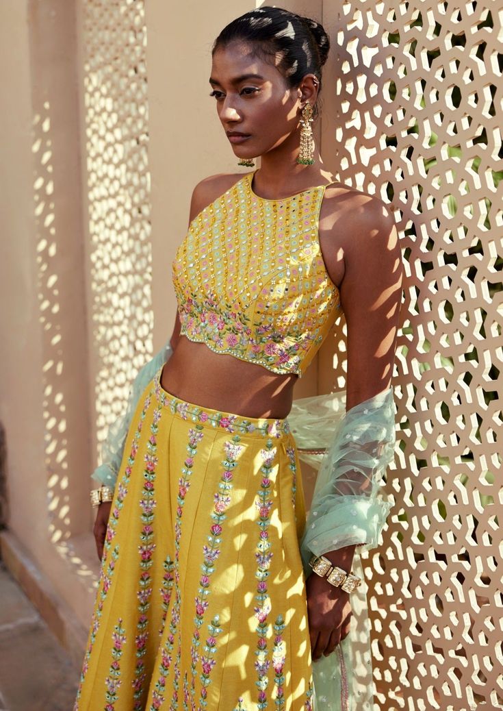 Yellow dupion silk resham and mirror work embroidered pants and incut shoulder top paired with contrast tulle dupatta. Mehendi Function, Haldi Outfit, Vacuum Storage, Bustling City, Palazzo Set, Indian Wedding Wear, Embroidered Pants, Dupion Silk, Western Wedding