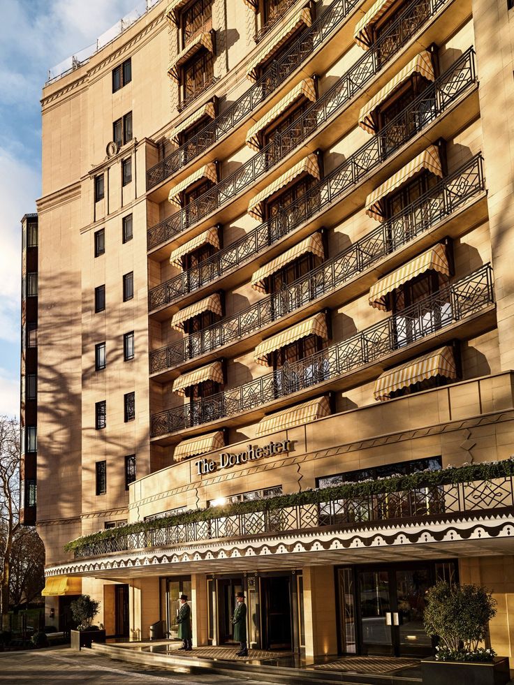 an apartment building with balconies on the top floor and balcony railings above it