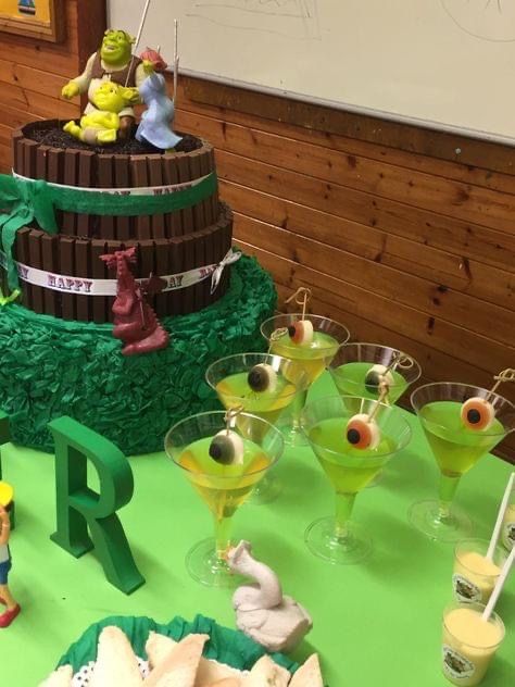 a table topped with lots of desserts and drinks