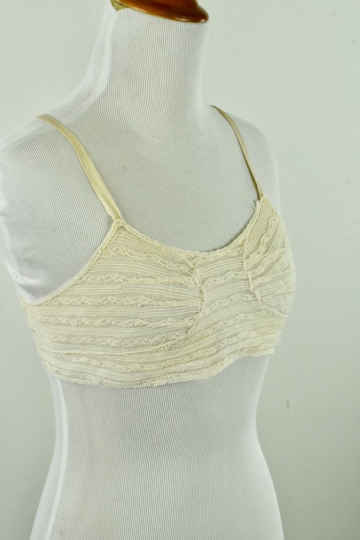 Here is a rarely found 1920s ivory lace brassiere with satin silk straps. 5 hooks and eyes complete closure. It is in excellent condition with light overall wear - no stains or holes. It is for a young lady, quite small in size, measuring at bottom / band 26 1/2 inches. The cup would be a AA. note: the brassiere was too small for the mannequin, so a ribbon was used to secure for photography. Cotton Bra, Bra Items, Cotton Bras, 1920s Dress, Blue Gown, Boring Clothes, Satin Silk, Ivory Lace, Vintage Cotton