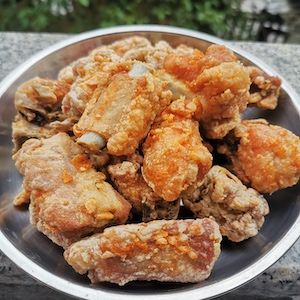 a plate full of fried food sitting on top of a table