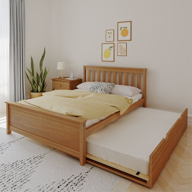 a bed with a wooden frame and mattress in a room next to a plant on the floor