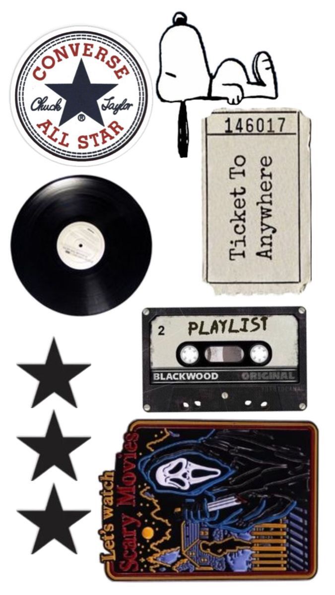 various stickers and decals are arranged on top of an old record player's cd