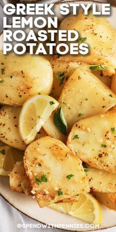 a white plate topped with potatoes covered in lemon