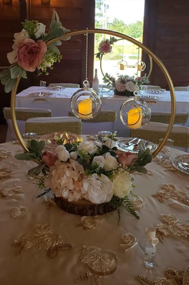 a table with flowers and candles on it