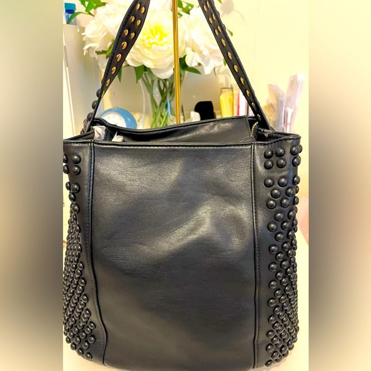 Measurement : Height 12” Wide 13” Deep 6.5” Drop 8” Trendy Black Satchel With Gunmetal Hardware, Black Bucket Shoulder Bag With Snap Closure, Black Satchel With Snap Closure For Daily Use, Black Bags With Snap Closure For Errands, Black Double Handle Bucket Bag With Zipper, Black Bucket Hobo Bag For Travel, Trendy Black Bags With Gunmetal Hardware, Black Shoulder Bag With Snap Closure For Errands, Black Hobo Bag With Gunmetal Hardware