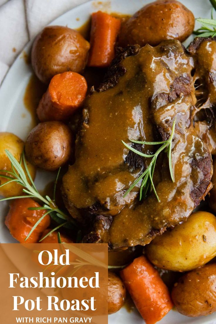 an old fashioned pot roast with potatoes and carrots on a white plate next to rosemary sprigs