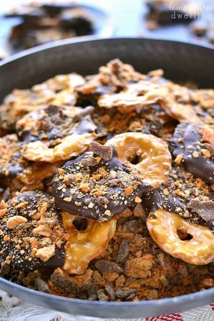 a pan filled with chocolate covered pretzels on top of a table