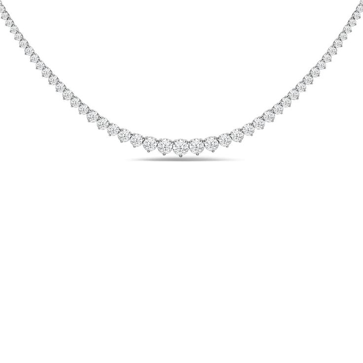 This necklace is bound to be a treasured piece of jewelry. It features a gorgeous line of brilliant-cut diamonds, gently and gradually tapering in size, with the largest at the center. Each diamond is secured on a three-prong basket. The timeless and enduring elegance of this piece gives you the flexibility to wear it on its own, layer it or pair it with other jewelry pieces. Luxury Lab-grown Diamond Halo Ring In White Gold, Diamond Tennis Necklace, Tennis Necklace, Brilliant Cut Diamond, Wear It, Jewelry Pieces, Diamond Cuts, Tennis, Lab