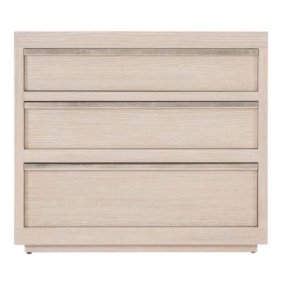 a white dresser with three drawers